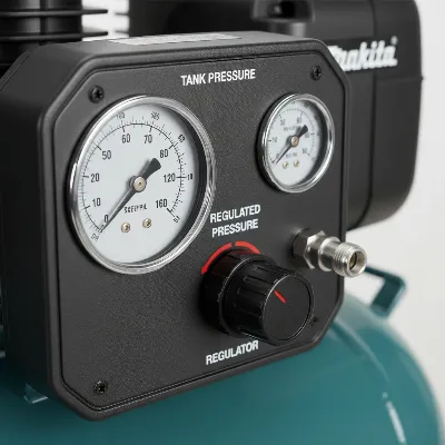 Close-up of the Makita MAC210Q Quiet Series Air Compressor's control panel and gauges.